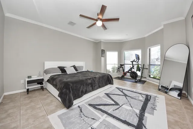 a bedroom with a bed and window