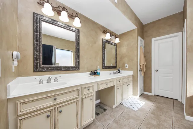 a bathroom with a bathtub and a sink