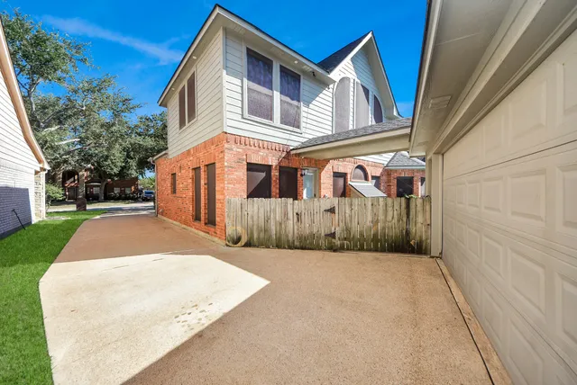 a view of a backyard with potted plants