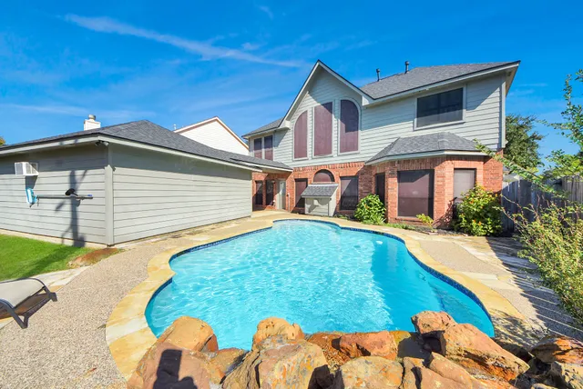 a front view of house with yard and outdoor seating