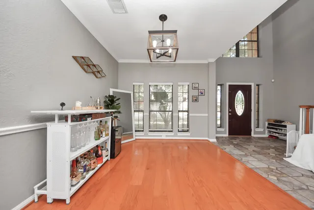 a very nice looking room with a large window and a flat screen tv