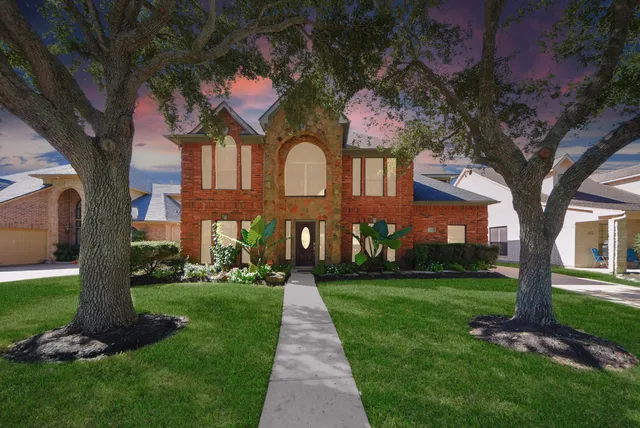 an aerial view of a house with outdoor space