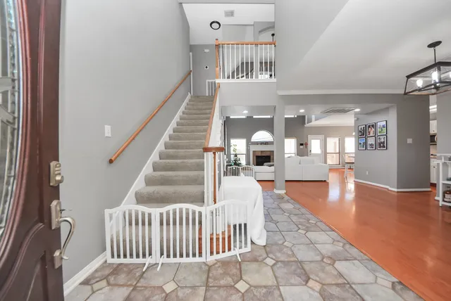 a view of livingroom with dining room and stairs