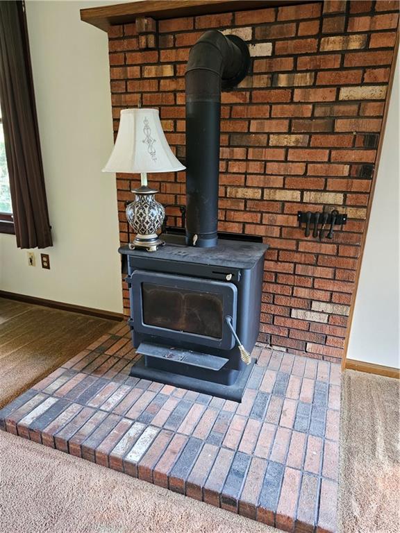 1015 McElree Road Washington, PA 15301 - Photo 17 of 48 a living room with a fireplace and a wooden floor