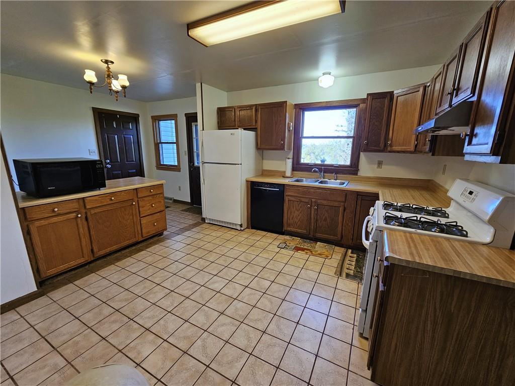 1015 McElree Road Washington, PA 15301 - Photo 21 of 48 a kitchen with stainless steel appliances granite countertop a stove a sink and a refrigerator