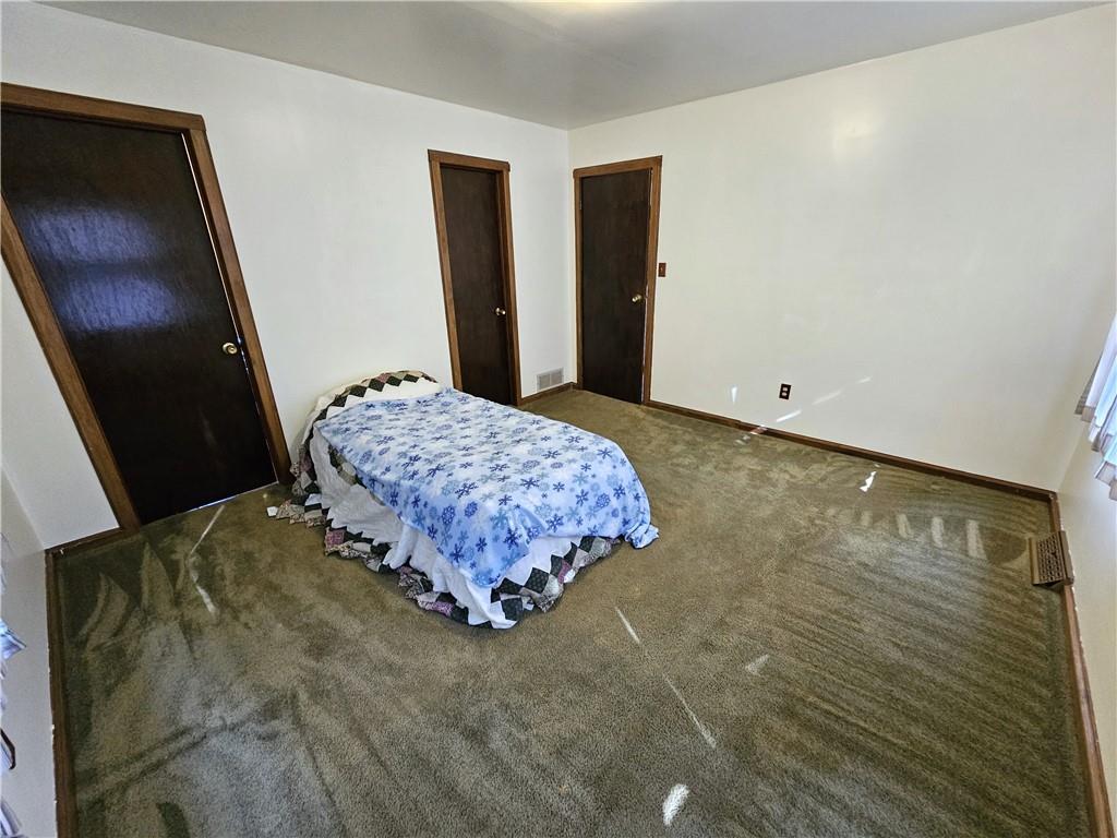 1015 McElree Road Washington, PA 15301 - Photo 30 of 48 a bedroom with a bed and a mirror