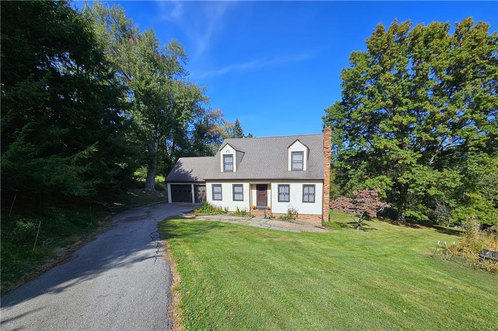 1015 McElree Road Washington, PA 15301 - Photo 3 of 48 a front view of a house with garden