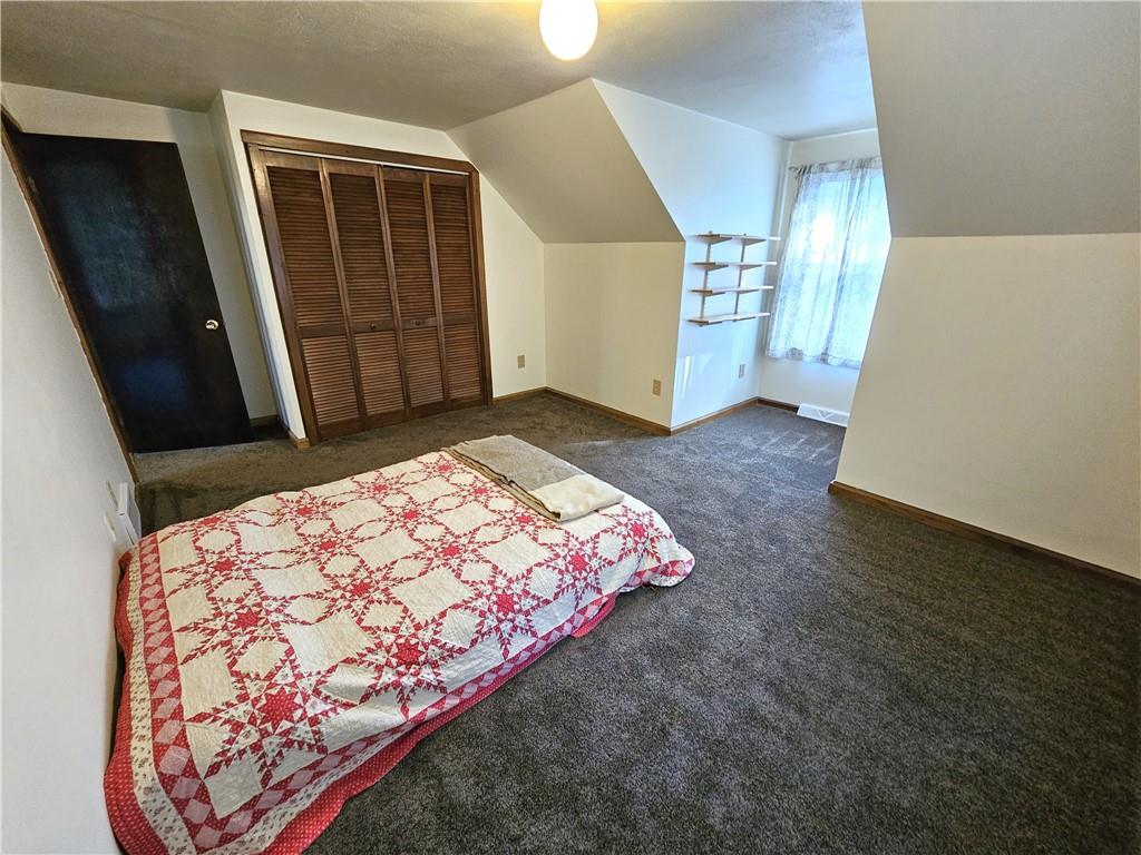 1015 McElree Road Washington, PA 15301 - Photo 36 of 48 a bedroom with a bed and a mirror