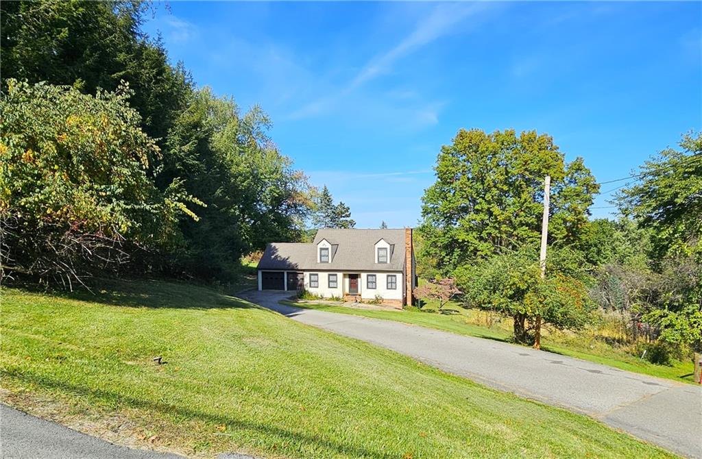 1015 McElree Road Washington, PA 15301 - Photo 4 of 48 a view of a garden with a building in the background