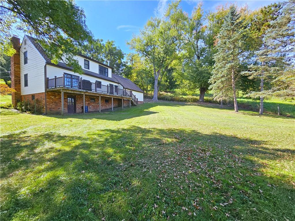 1015 McElree Road Washington, PA 15301 - Photo 5 of 48 a view of a house with a big yard and large trees