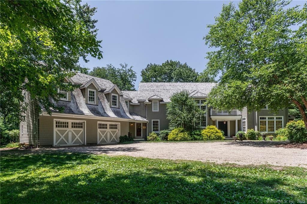 a view of house with yard and entertaining space