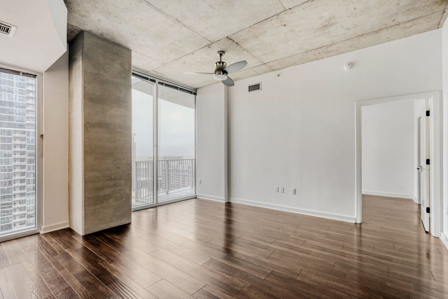 360 Nueces Street, Unit 2004 Austin, TX 78701 - Photo 17 of 34 an empty room with wooden floor and windows