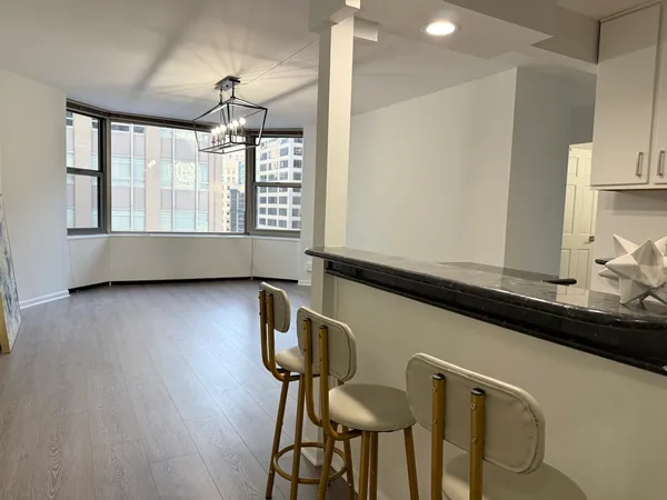 a view of room with furniture and windows