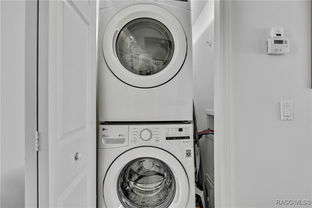 2855 North Rivers Edge Boulevard, Unit 213 Crystal River, FL 34429 - Photo 13 of 62 a view of entryway with washer and dryer