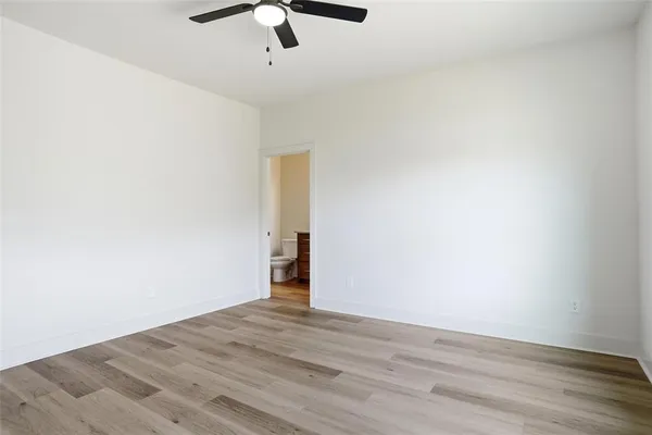 a view of a room with wooden floor