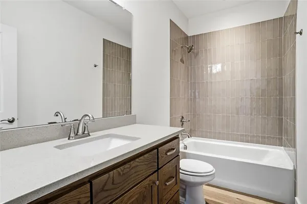 a bathroom with a sink a toilet and a bathtub