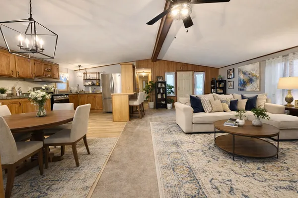 a living room with furniture and a lamp