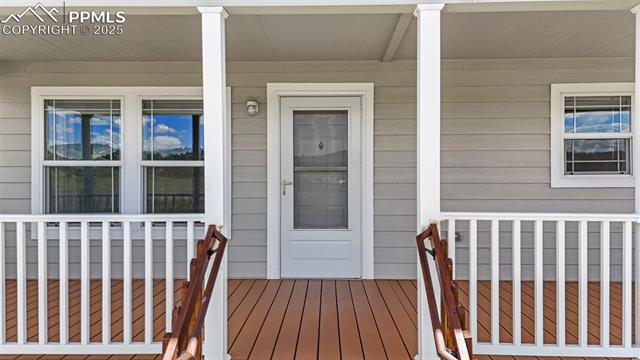 567 High Pasture Road Florissant, CO 80816 - Photo 36 of 48 View of exterior entry featuring covered porch
