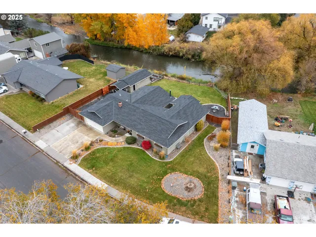an aerial view of a house with a lake view