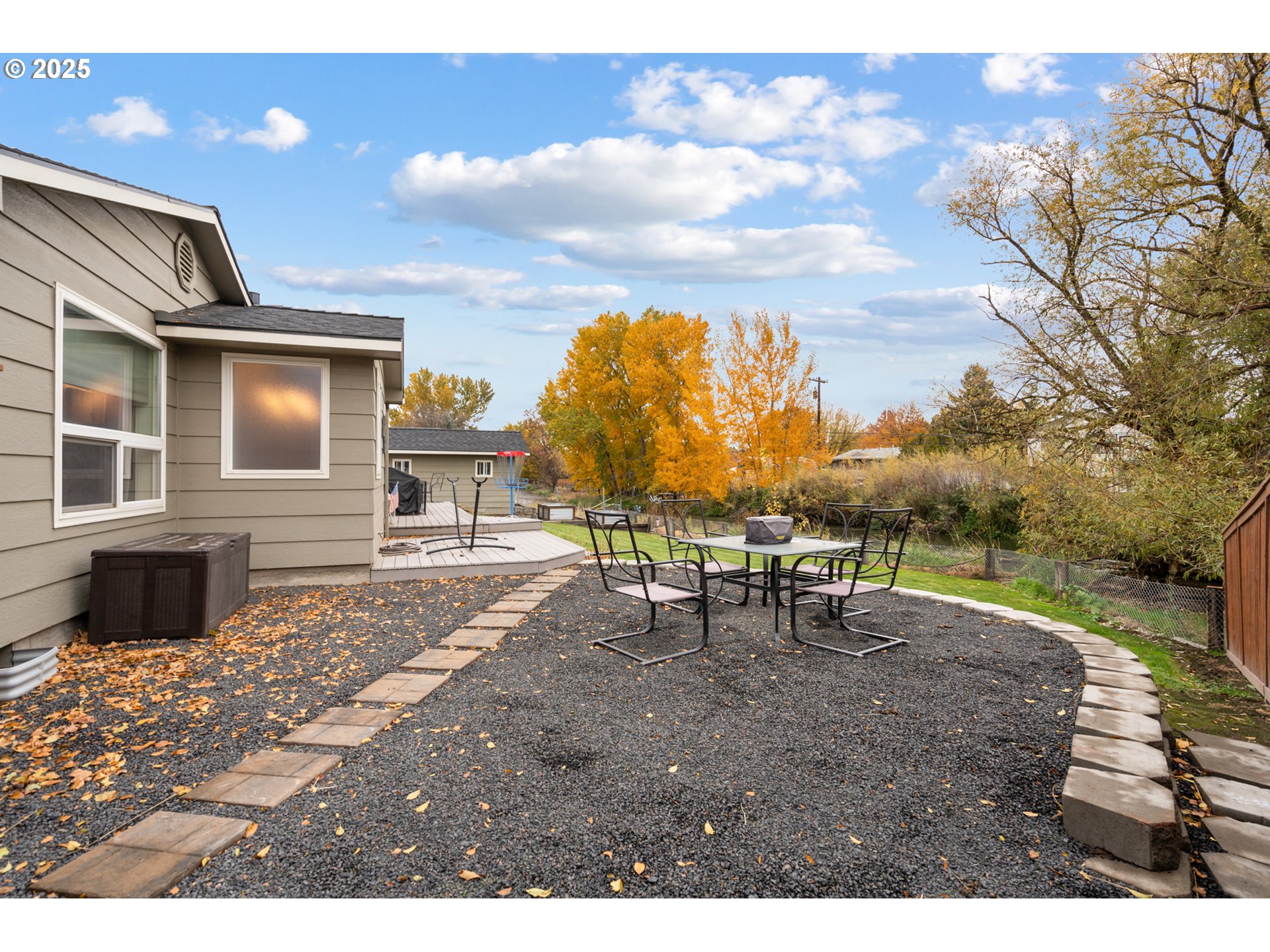1328 Southwest 44th Street Pendleton, OR 97801 - Photo 36 of 43 a view of a patio with table and chairs with wooden floor and fence