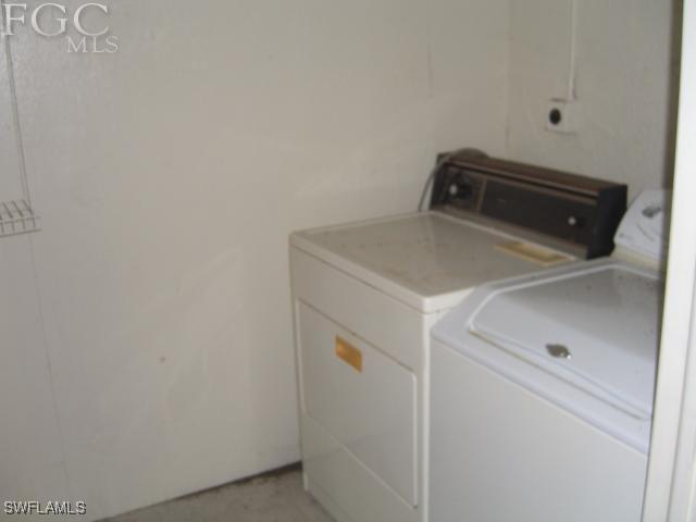 18221 Matanzas Road Fort Myers, FL 33967 - Photo 9 of 10 a utility room with dryer and washer