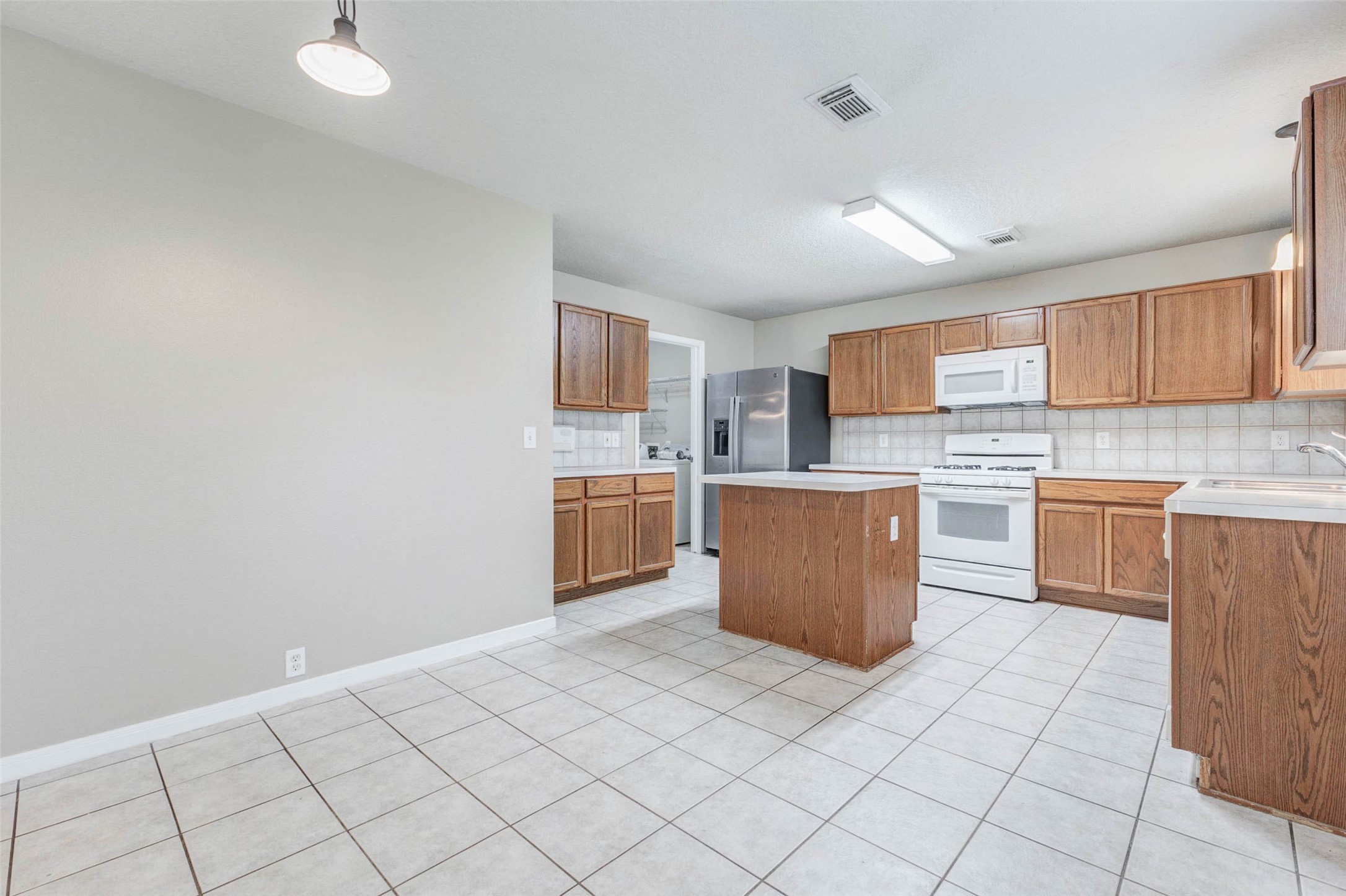 18327 Atasca Wds Trace Humble, TX 77346 - Photo 11 of 28 a kitchen with a cabinets and counter space