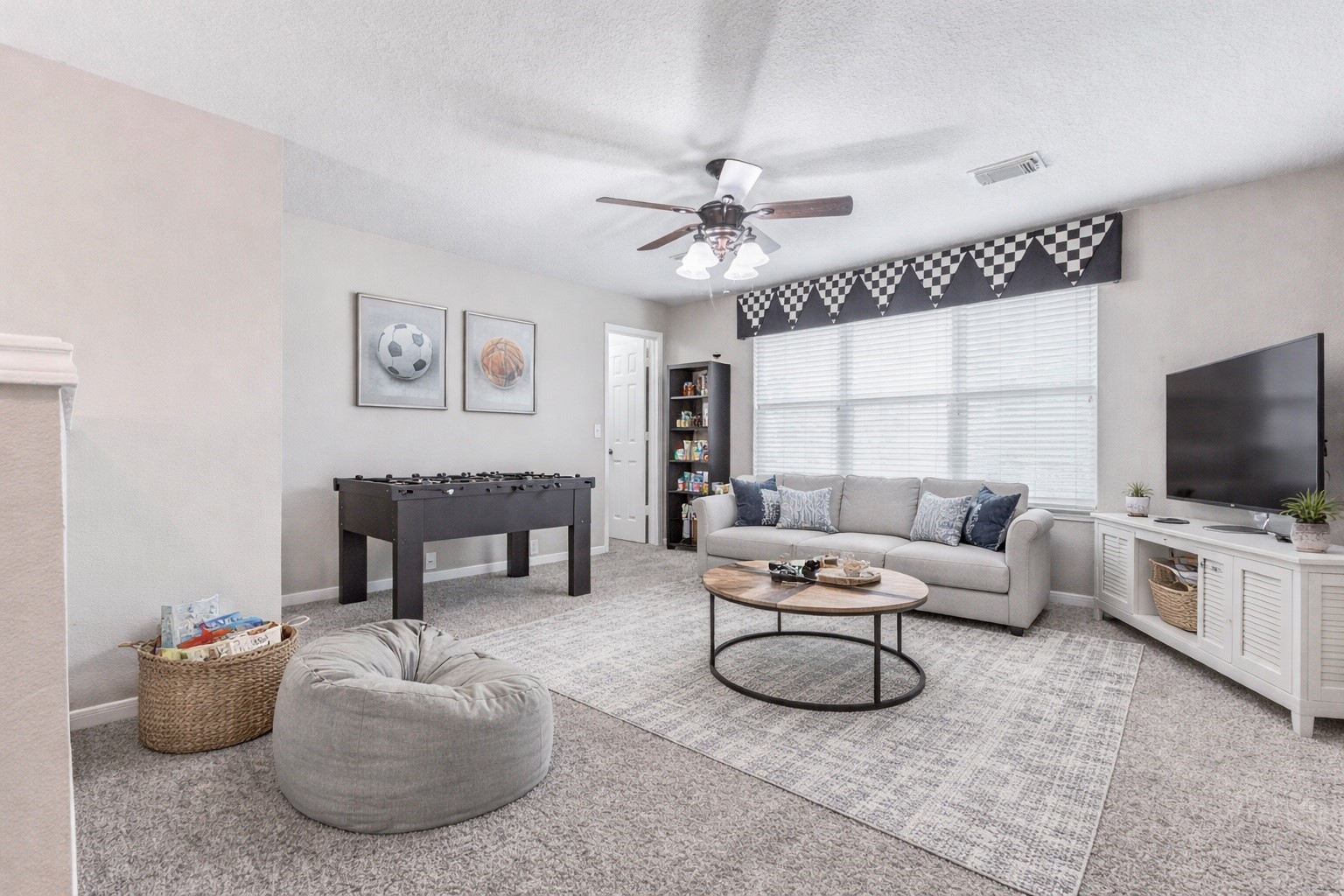 18327 Atasca Wds Trace Humble, TX 77346 - Photo 20 of 28 a living room with furniture a flat screen tv and a fireplace