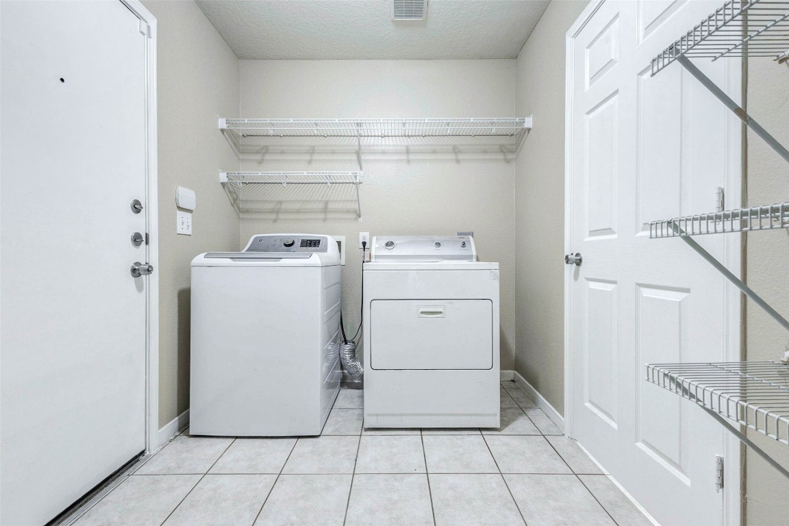 18327 Atasca Wds Trace Humble, TX 77346 - Photo 25 of 28 a utility room with dryer and washer