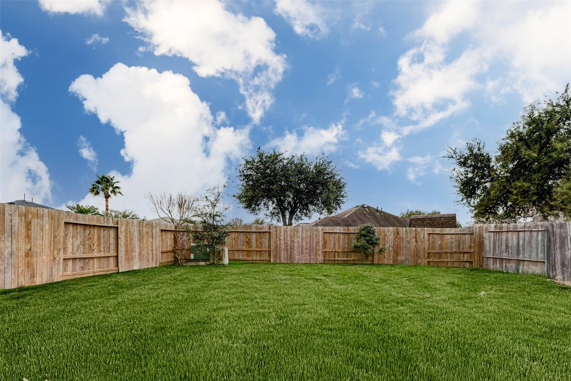 18327 Atasca Wds Trace Humble, TX 77346 - Photo 26 of 28 a view of a house with backyard and sitting area