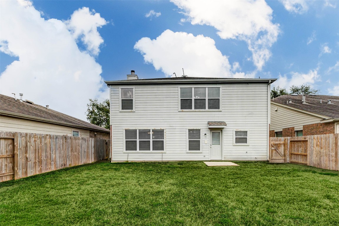 18327 Atasca Wds Trace Humble, TX 77346 - Photo 27 of 28 a view of a house with backyard