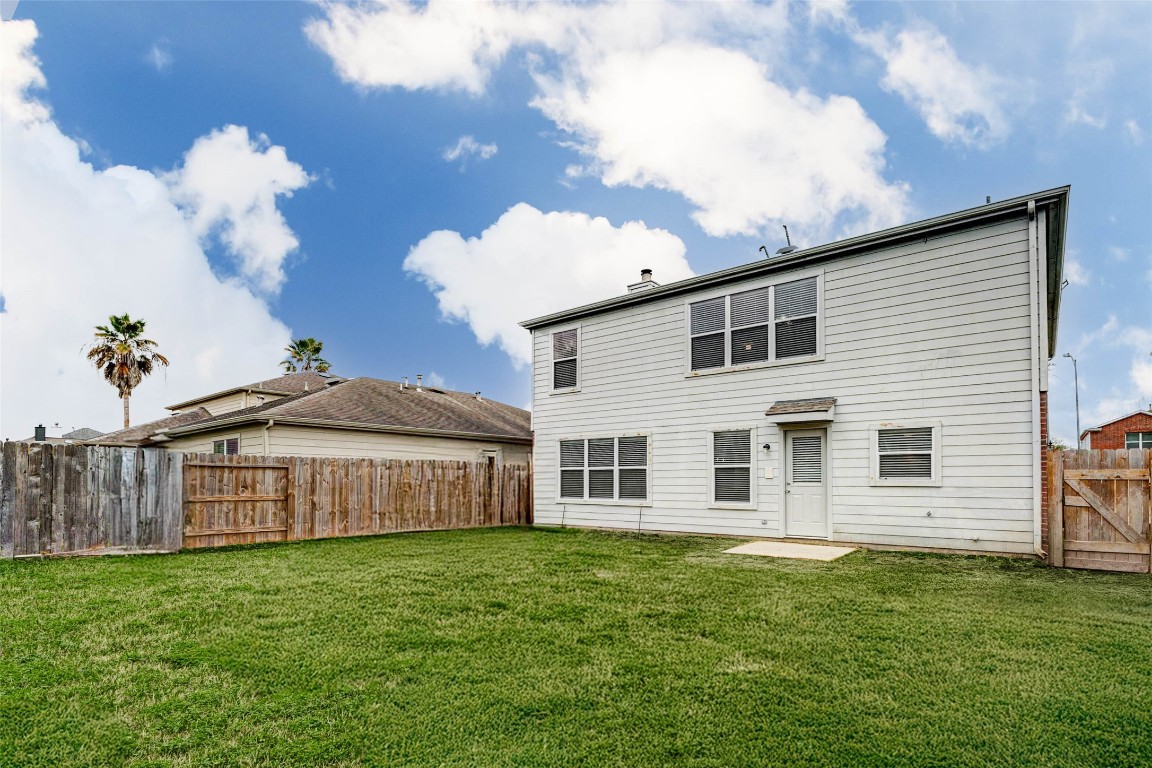 18327 Atasca Wds Trace Humble, TX 77346 - Photo 28 of 28 a front view of a house with garden