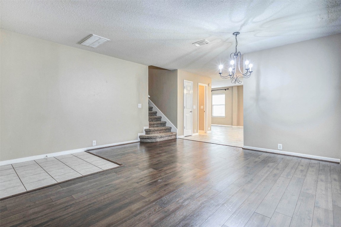 18327 Atasca Wds Trace Humble, TX 77346 - Photo 3 of 28 a view of empty room with wooden floor and window