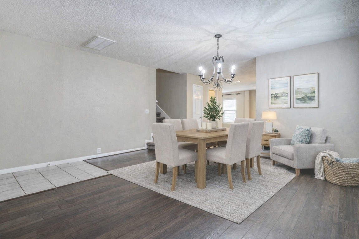 18327 Atasca Wds Trace Humble, TX 77346 - Photo 4 of 28 a view of a dining room with furniture and chandelier