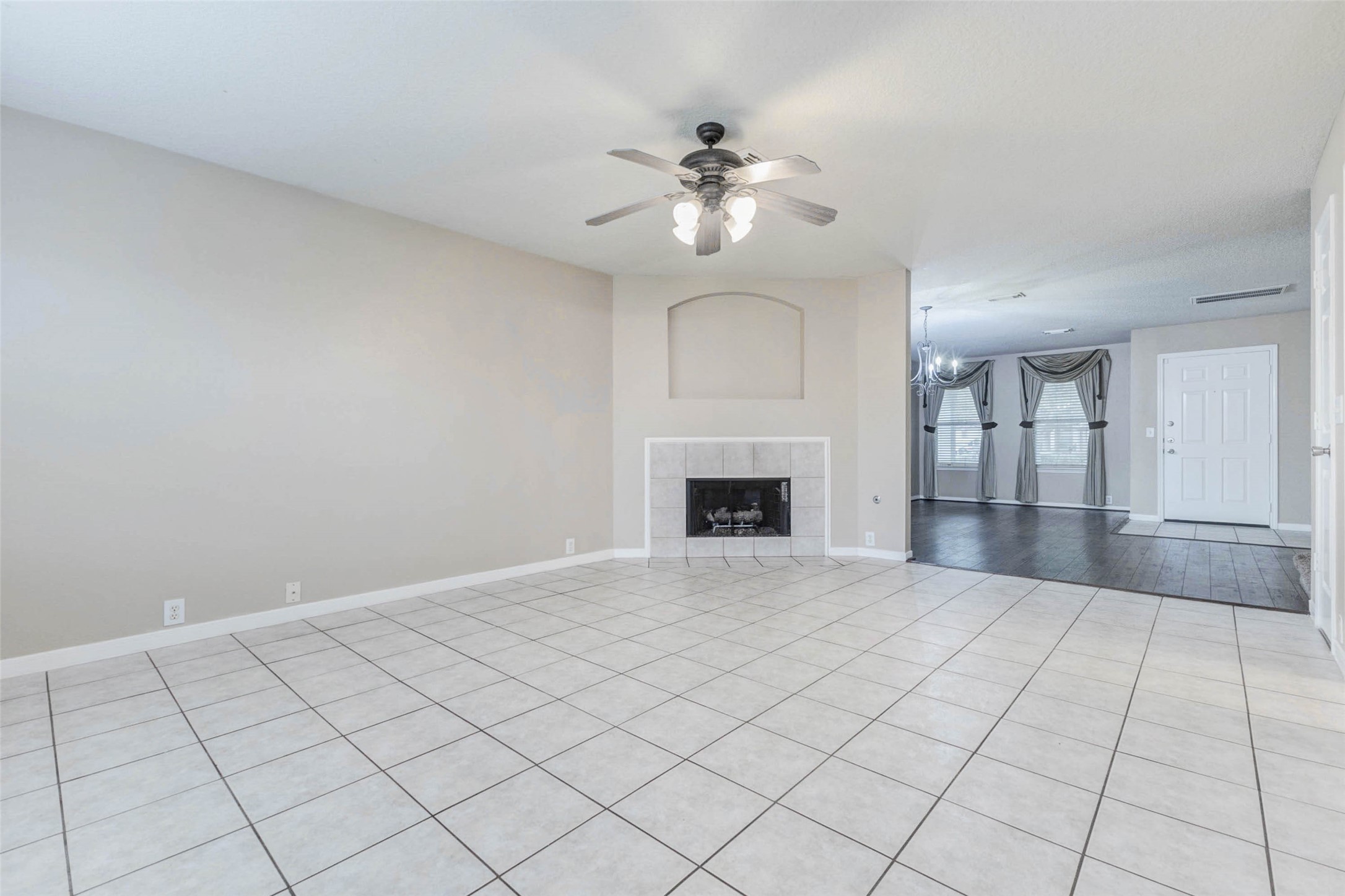 18327 Atasca Wds Trace Humble, TX 77346 - Photo 7 of 28 a view of an empty room with a fireplace