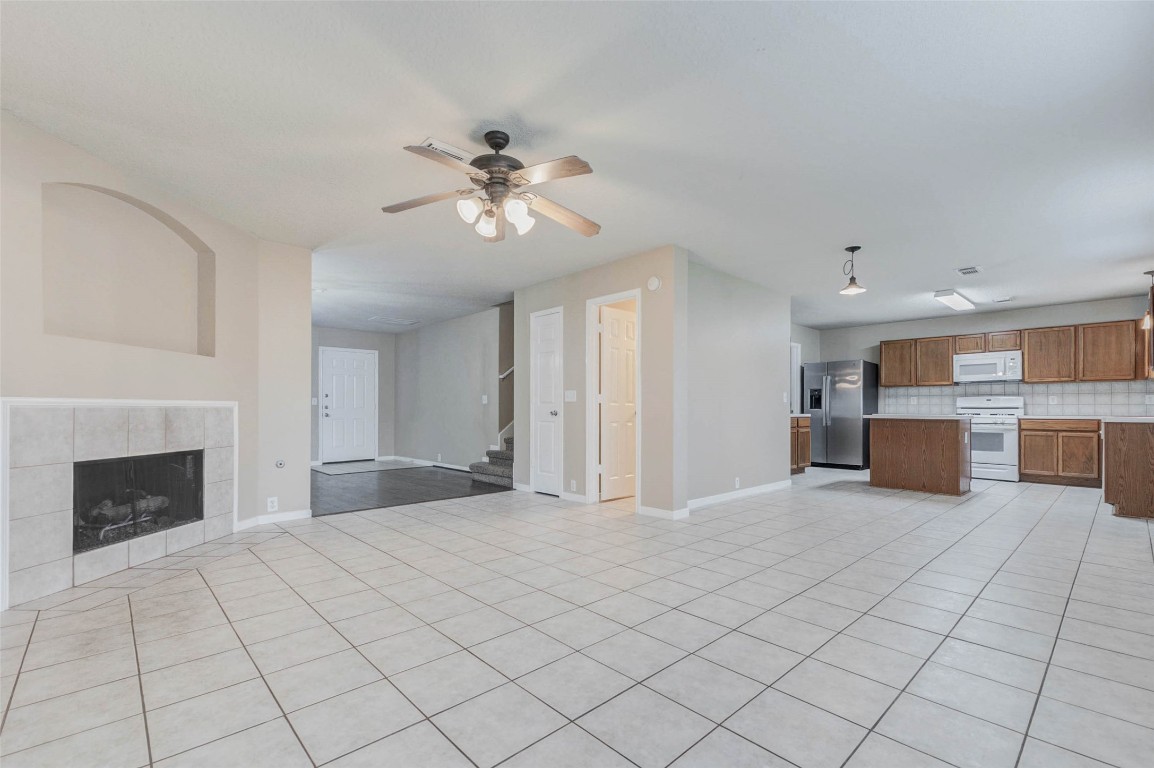 18327 Atasca Wds Trace Humble, TX 77346 - Photo 8 of 28 a view of an empty room with a fireplace