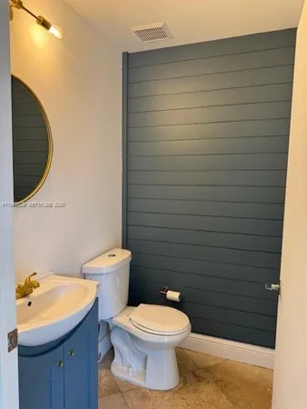 a view of a room that has a bed and a window