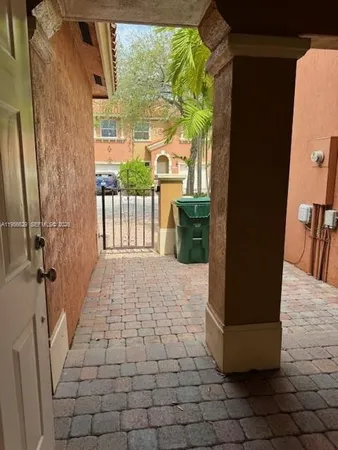 a view of a porch with a floor to ceiling window