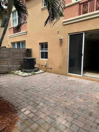 a view of a patio with a fountain