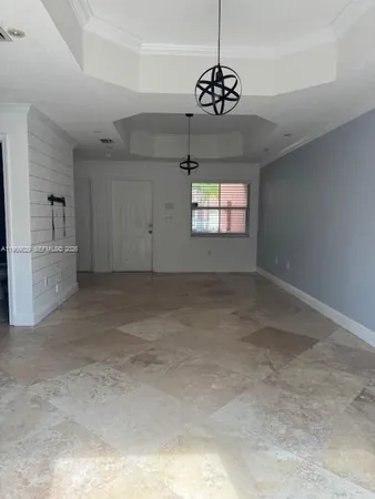 a kitchen with stainless steel appliances granite countertop a sink dishwasher a stove and a refrigerator with wooden floor