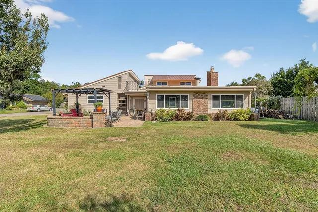 a kitchen with stainless steel appliances granite countertop a refrigerator a stove and a sink