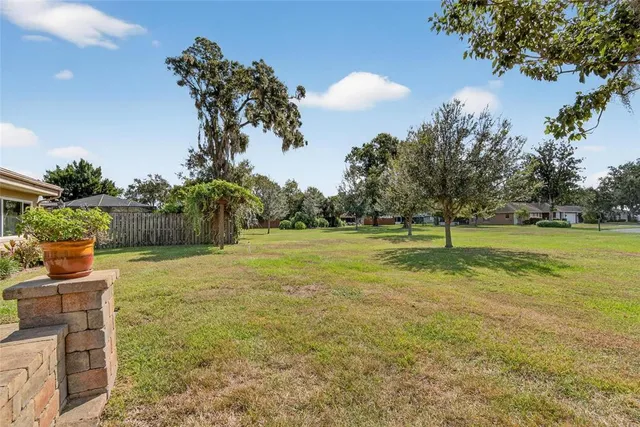 a dining room with furniture a rug and wooden floor