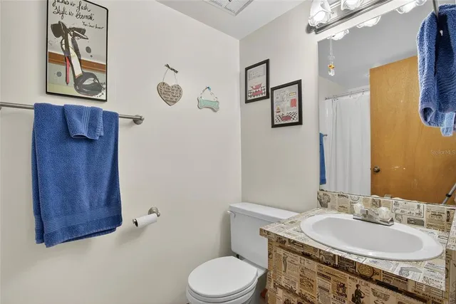 a view of a dining room and livingroom with furniture