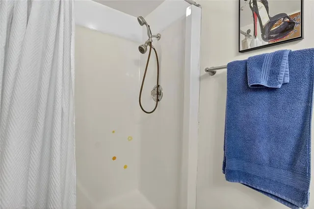 a living room with furniture a wooden floor and chandelier