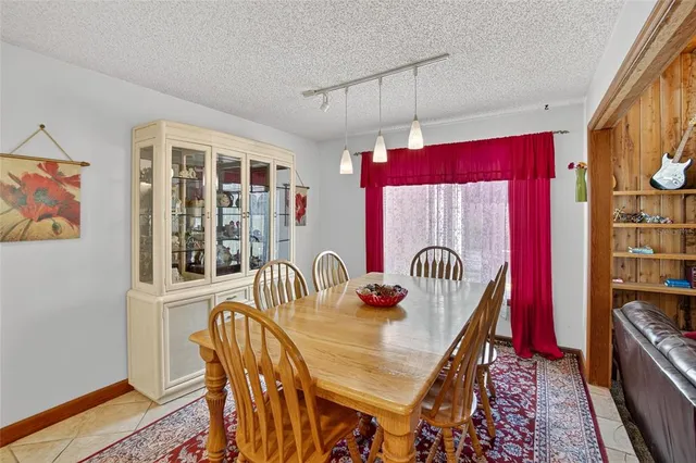 a living room with fireplace furniture and a flat screen tv