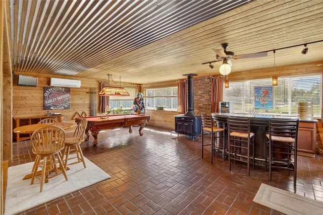 a view of a room with a door and wooden floor