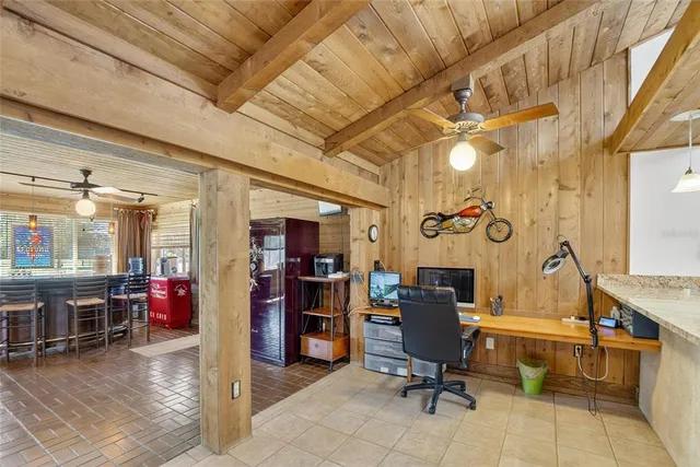 a bathroom with a granite countertop toilet sink and mirror