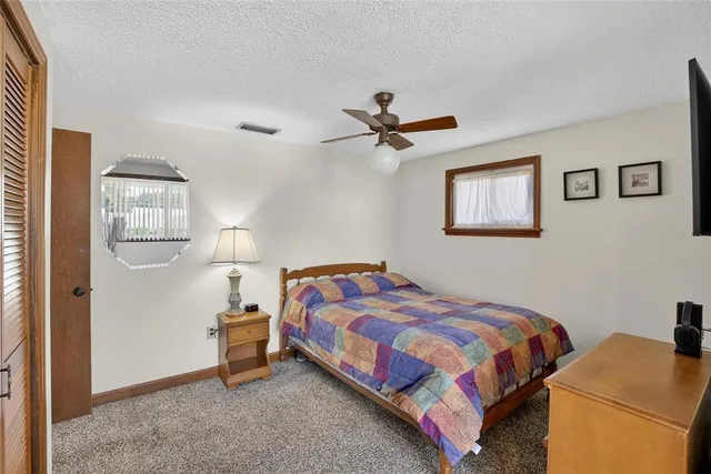 an aerial view of a house with a garden and a yard