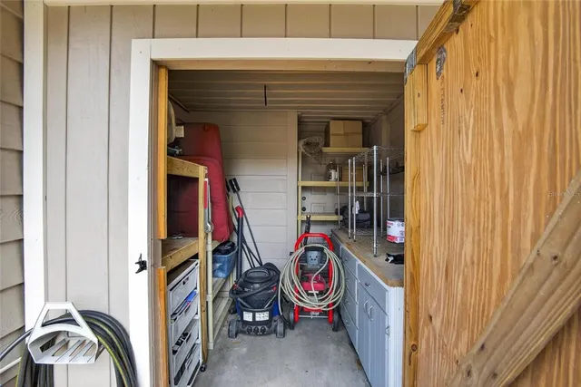 a bathroom with a granite countertop toilet sink and mirror