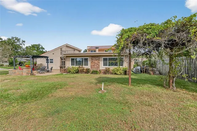 a kitchen with granite countertop stainless steel appliances and wooden cabinets