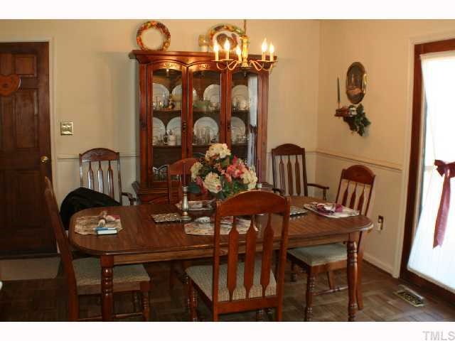 4072 Raney Way Drive Stem, NC 27581 - Photo 6 of 12 Formal dining area with WATER view out the back door's glass windows.